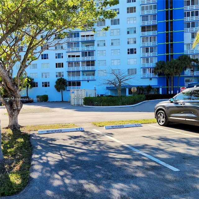 view of property featuring uncovered parking