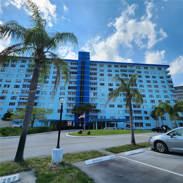 view of property with uncovered parking