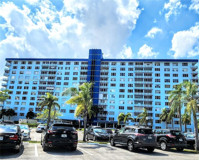 view of property featuring uncovered parking