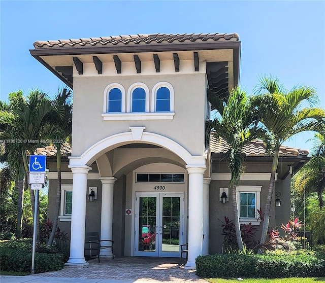4001 Hillcrest Dr Unit 602-4, Hollywood, FL 33021 - view of front facade with french doors, stucco siding, and a tiled roof