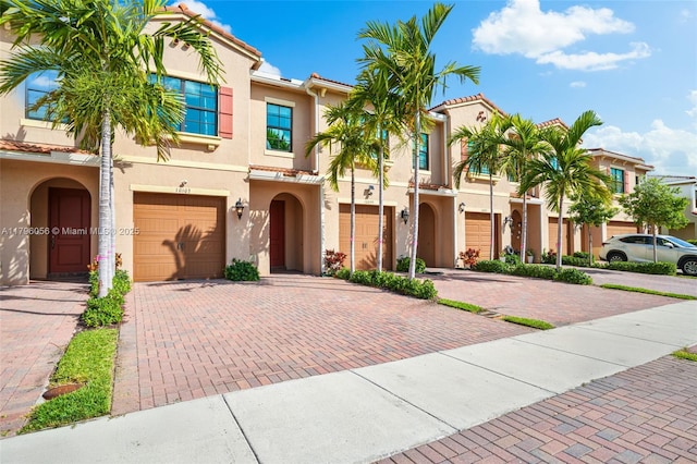 10103 Akenside Dr, Boca Raton, FL 33428 - view of front of property with a garage, driveway, and stucco siding
