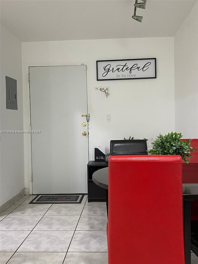 dining area featuring tile patterned floors and electric panel