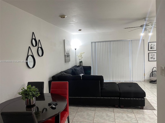living room featuring ceiling fan and light tile patterned floors