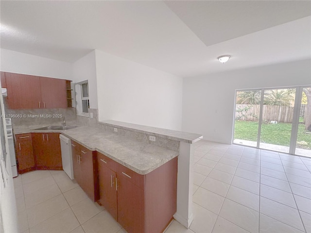kitchen featuring white dishwasher, open shelves, light tile patterned floors, light countertops, and a peninsula