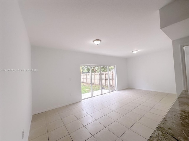 spare room with light tile patterned flooring