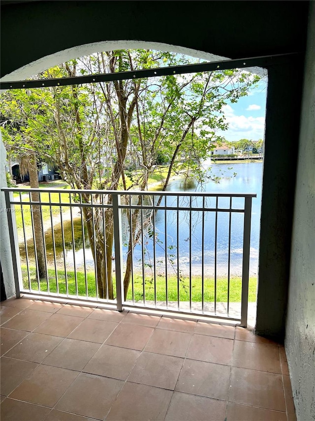 balcony featuring a water view