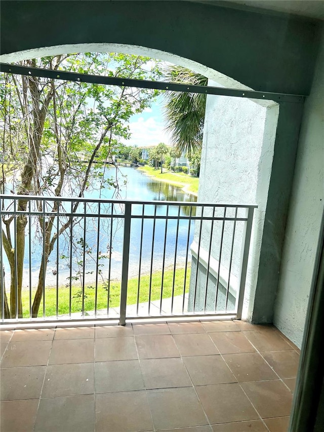 balcony featuring a water view
