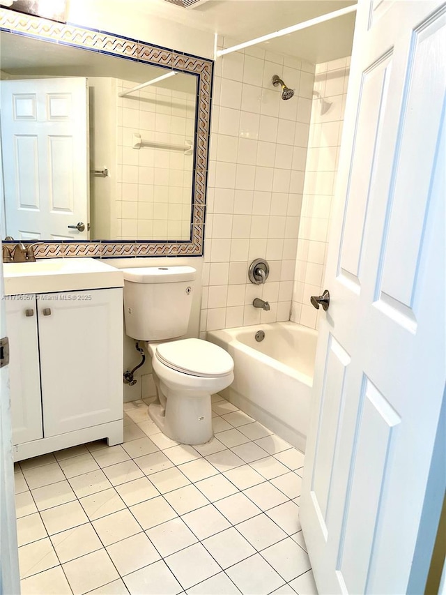 full bathroom with toilet, tile patterned floors, washtub / shower combination, and vanity