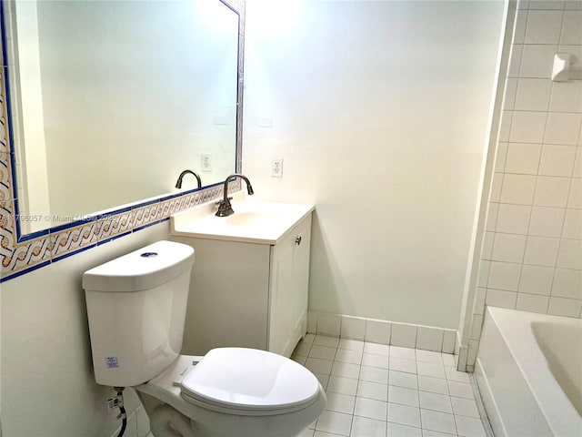 full bath featuring vanity, tile patterned flooring, and toilet