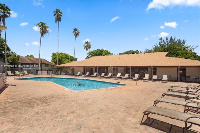 community pool with a patio area