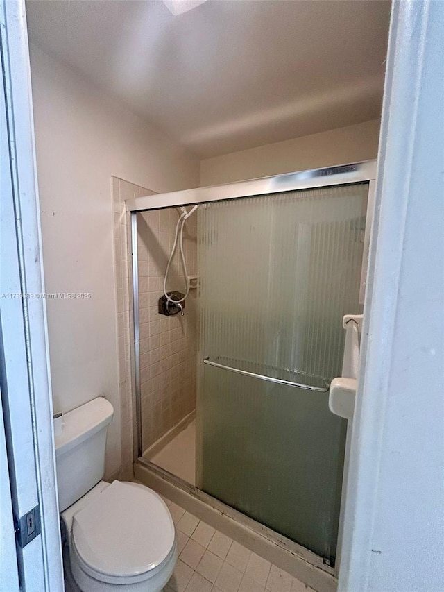156 W Laurel Dr Unit 1006, Margate, FL 33063 - bathroom with tile patterned floors, toilet, and a shower stall