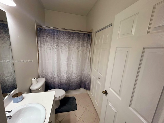 bathroom with vanity, tile patterned floors, toilet, and a shower with curtain