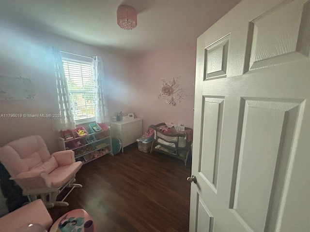 sitting room with dark wood-style floors