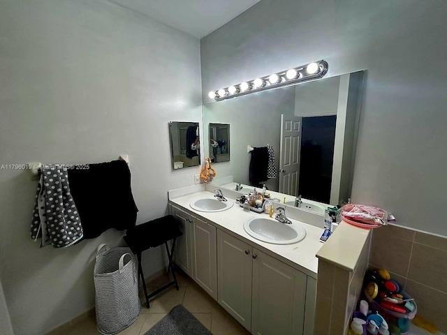 full bathroom with a sink, tile patterned floors, and double vanity