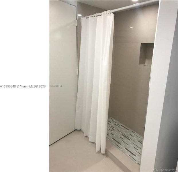 bathroom with curtained shower