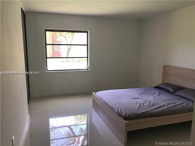 bedroom featuring multiple windows