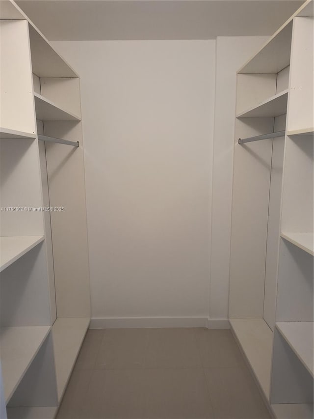 20841 San Simeon Way Unit 104, Miami, FL 33179 - spacious closet featuring tile patterned flooring