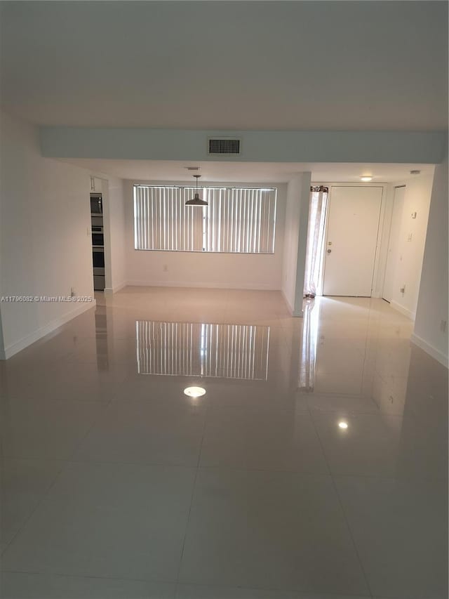 20841 San Simeon Way Unit 104, Miami, FL 33179 - tiled spare room with baseboards