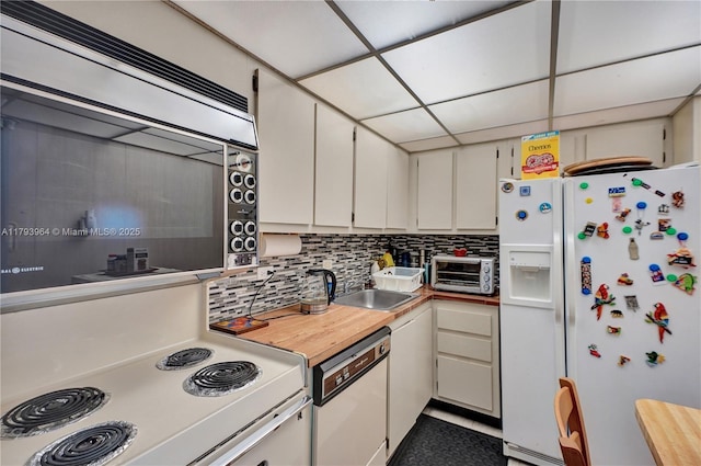 20505 E Country Club Dr Unit 732, Aventura, FL 33180 - kitchen featuring white appliances, tasteful backsplash, a sink, and white cabinetry