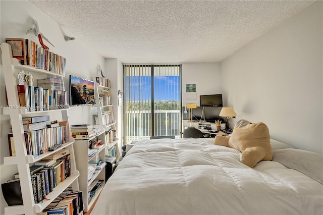 20505 E Country Club Dr Unit 732, Aventura, FL 33180 - bedroom with access to outside, a textured ceiling, and expansive windows