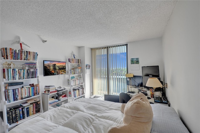 20505 E Country Club Dr Unit 732, Aventura, FL 33180 - bedroom with a textured ceiling and access to outside