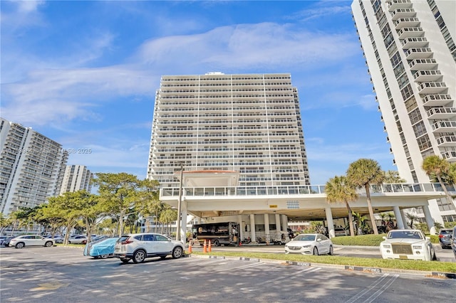 20505 E Country Club Dr Unit 732, Aventura, FL 33180 - view of building exterior with uncovered parking