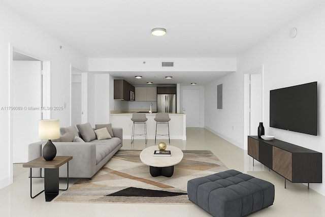 living area featuring baseboards and visible vents