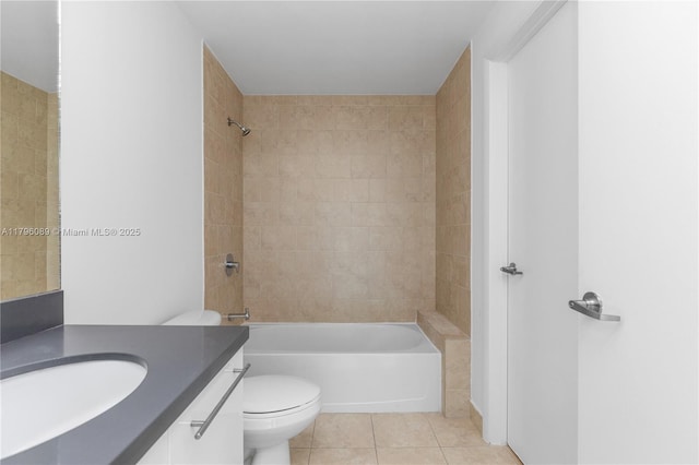 bathroom with vanity, tile patterned flooring, shower / bathing tub combination, and toilet