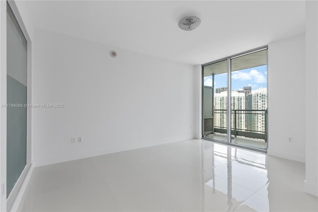 empty room with floor to ceiling windows