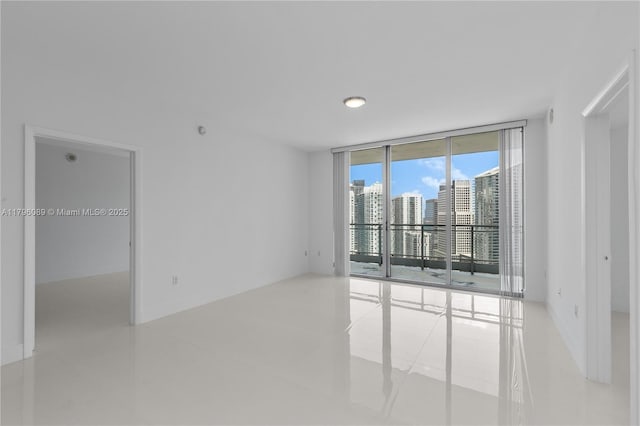 spare room featuring expansive windows