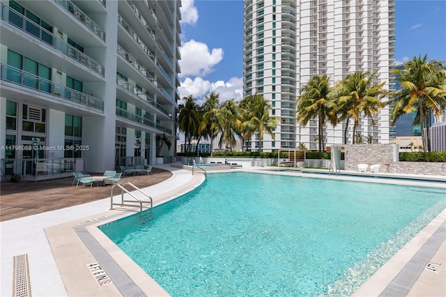 community pool featuring a patio area