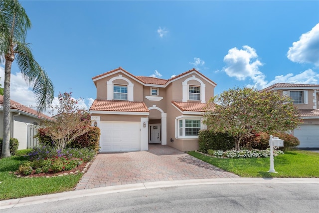 504 Bedford Ave, Weston, FL 33326 - mediterranean / spanish-style house with stucco siding, a tile roof, decorative driveway, an attached garage, and a front yard
