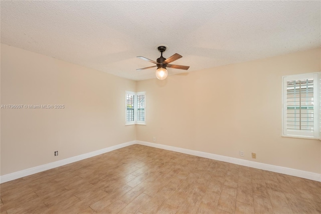504 Bedford Ave, Weston, FL 33326 - unfurnished room featuring ceiling fan, light wood finished floors, and a textured ceiling
