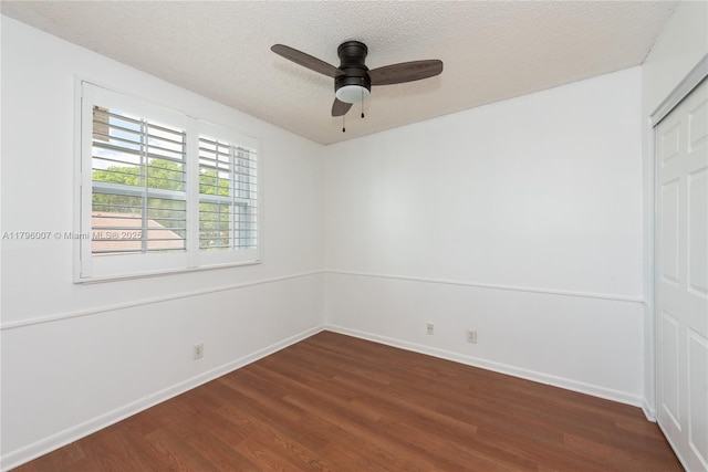 504 Bedford Ave, Weston, FL 33326 - unfurnished room featuring dark wood-style flooring, a textured ceiling, a ceiling fan, and baseboards