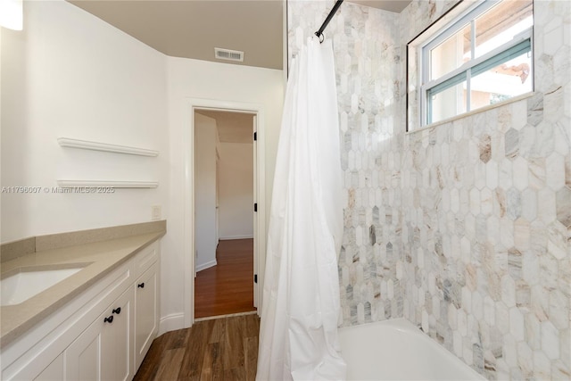 504 Bedford Ave, Weston, FL 33326 - full bath featuring shower / tub combo, vanity, and wood finished floors