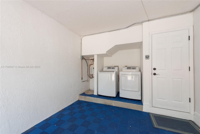 504 Bedford Ave, Weston, FL 33326 - laundry area with separate washer and dryer and a textured ceiling