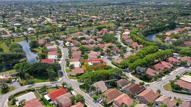 504 Bedford Ave, Weston, FL 33326 - aerial overview of property's location with a nearby body of water, nearby suburban area, and property parcel outlined