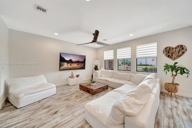 living room featuring visible vents, wood finished floors, baseboards, recessed lighting, and a ceiling fan