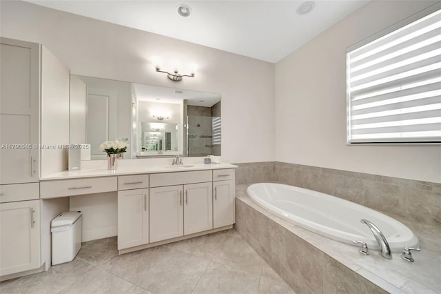 full bathroom with vanity, a shower stall, and a garden tub