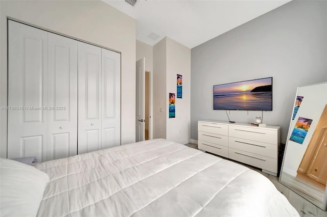 bedroom featuring baseboards and a closet