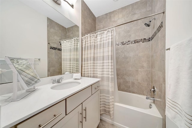 bathroom featuring shower / bath combo with shower curtain and vanity