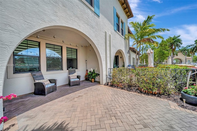 view of patio / terrace featuring fence
