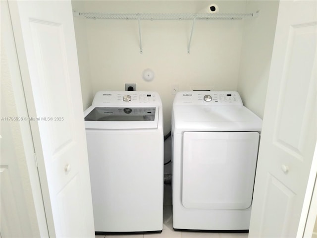 washroom featuring laundry area and washer and dryer