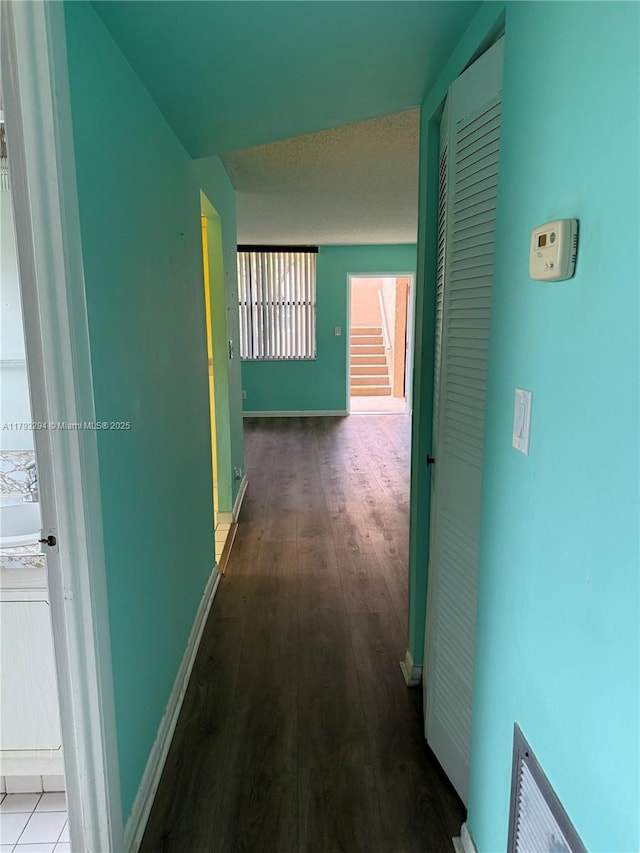 9121 Sunrise Lakes Blvd Unit 120, Sunrise, FL 33322 - corridor with baseboards, stairs, wood finished floors, and a wealth of natural light