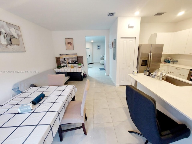 interior space featuring visible vents, recessed lighting, and light tile patterned flooring