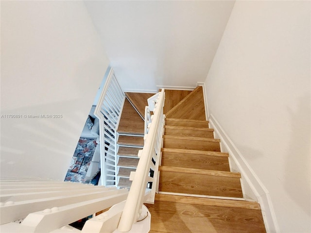 stairs with wood finished floors