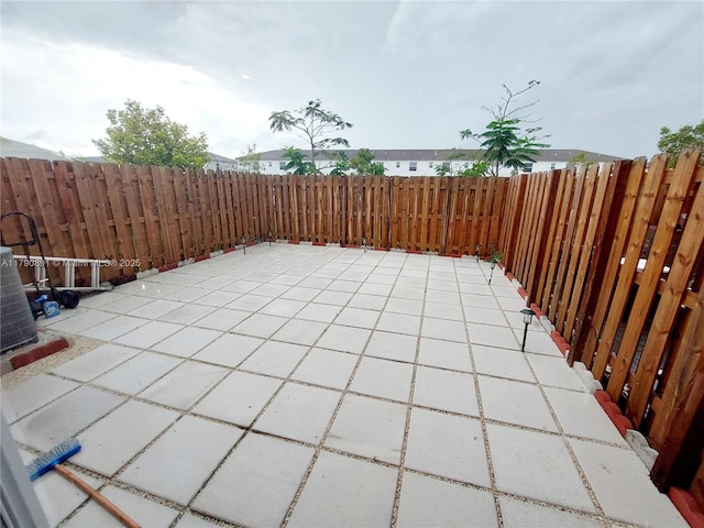 view of patio / terrace with a fenced backyard and central AC unit