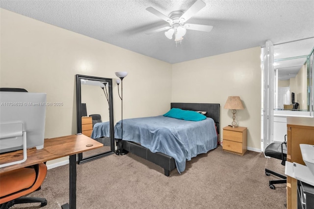 bedroom featuring carpet floors, ceiling fan, and a textured ceiling