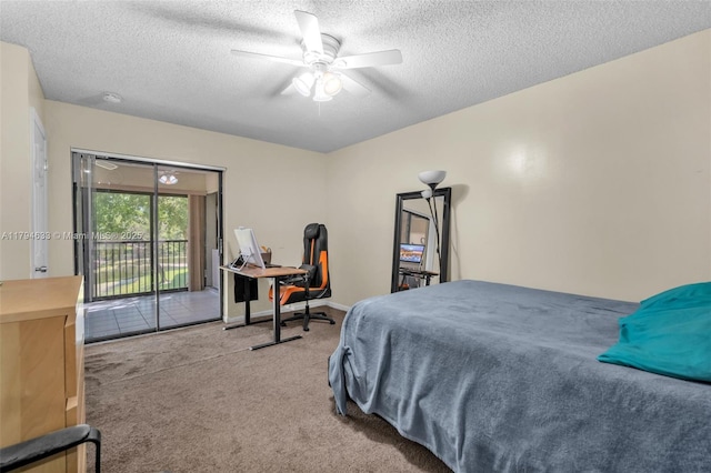 carpeted bedroom featuring access to outside, a textured ceiling, and a ceiling fan