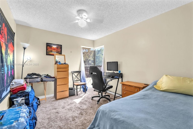 bedroom with carpet flooring, a textured ceiling, and baseboards